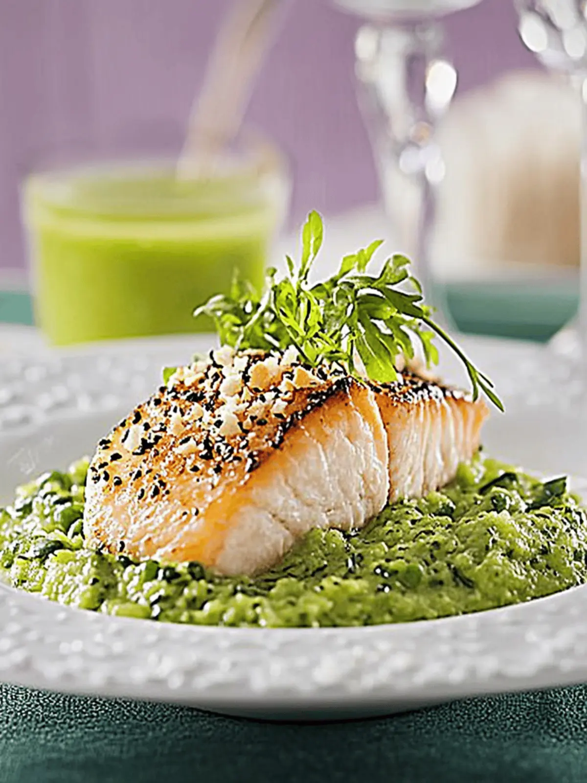 Salmon in sesame crust on pea puree and sugar snap pea straw