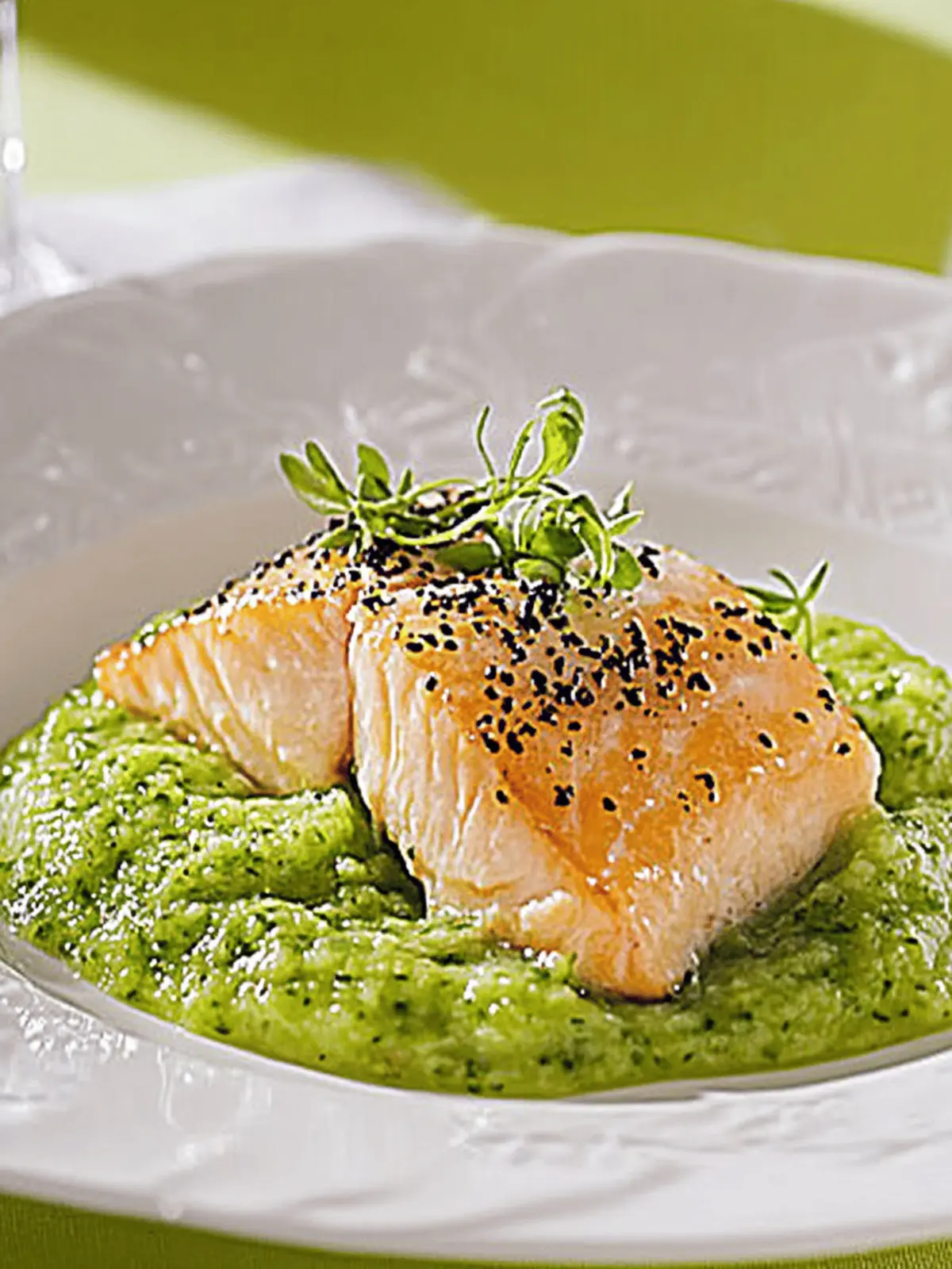 Salmon in sesame crust on pea puree and sugar snap pea straw